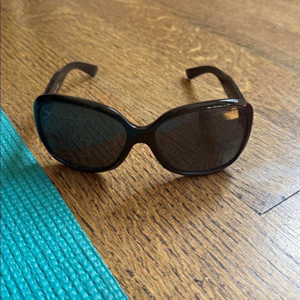 authentic Prada sunglasses. Lightly worn.   Authenticity materials included
